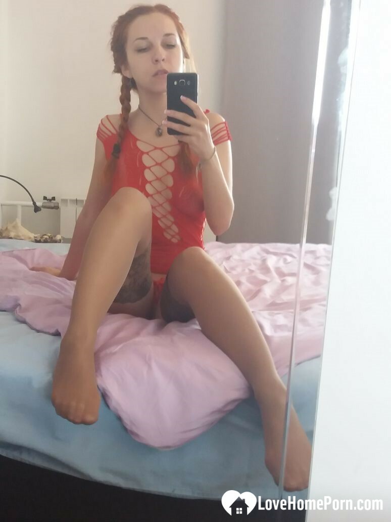 Smoking redhead teases in stockings in the bedroom — 5